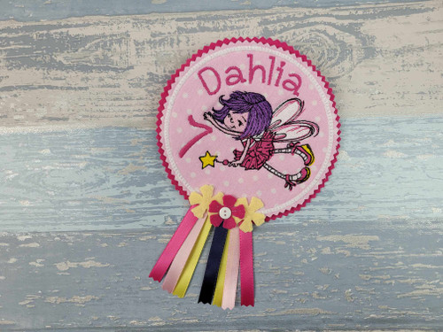 Cute Fairy Personalised Birthday Badge

My badges are made custom to your requirements.

Made from Felt and Fabric, finished off with ribbons and a brooch pin at the back.

My badges measure approx 5.5 inches when finished

Matching Tooth Fairy Pillow can be found here: Cute Fairy Personalised Tooth Fairy Pillow (aheartlycraft.co.uk)

Other Fairy Items can be found here : A Heartly Craft