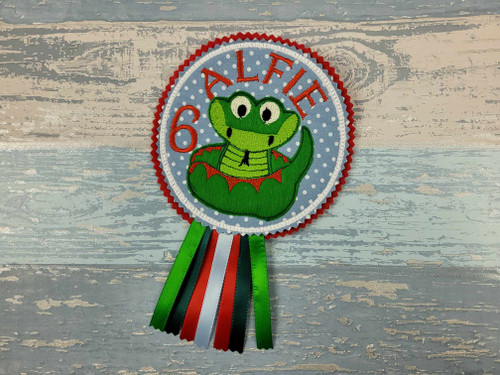 Snake Reptile Personalised Birthday Badge

My badges are made custom to your requirements.

Made from Felt and Fabric, finished off with ribbons and a brooch pin at the back.

My badges measure approx 5.5 inches when finished