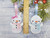 Personalised Snowman Decoration Christmas Tree Hanging Decorations
My snowmen decorations come in 2 sizes:

1: Small is 10cm, 2: Large is 13cm 

I make them from layers of felt with a little padding inside to give them a 3D look, and this makes them cute too.

If you choose female names then the snowman will be finished off with a pink/white bow and a pink scarf to match. The male named snowmen will not have a bow but will also come with a blue scarf.
The font will always be the same, but may look smaller for longer names.