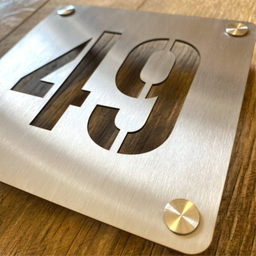 Stainless steel house number sign.