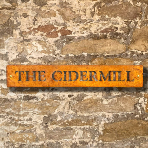 Corten steel gate sign. Narrow Corten steel sign.