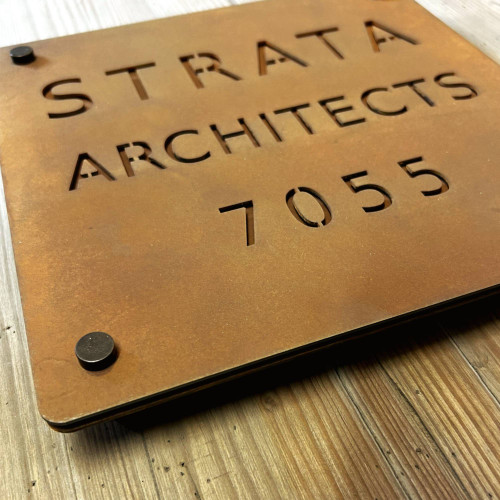 Double layer sign with a Corten steel front layer and Corten steel back layer