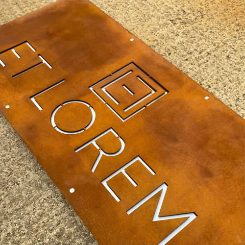 Double layer sign with a Corten steel front layer and stainless steel back layer