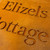 Double layer sign with a Corten steel front layer and Corten steel back layer