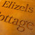 Double layer sign with a Corten steel front layer and Corten steel back layer