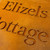 Double layer sign with a Corten steel front layer and Corten steel back layer