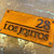 Corten steel house sign, rusty metal house name sign, rusty steel house name and number sign with dividing line between the name and number.