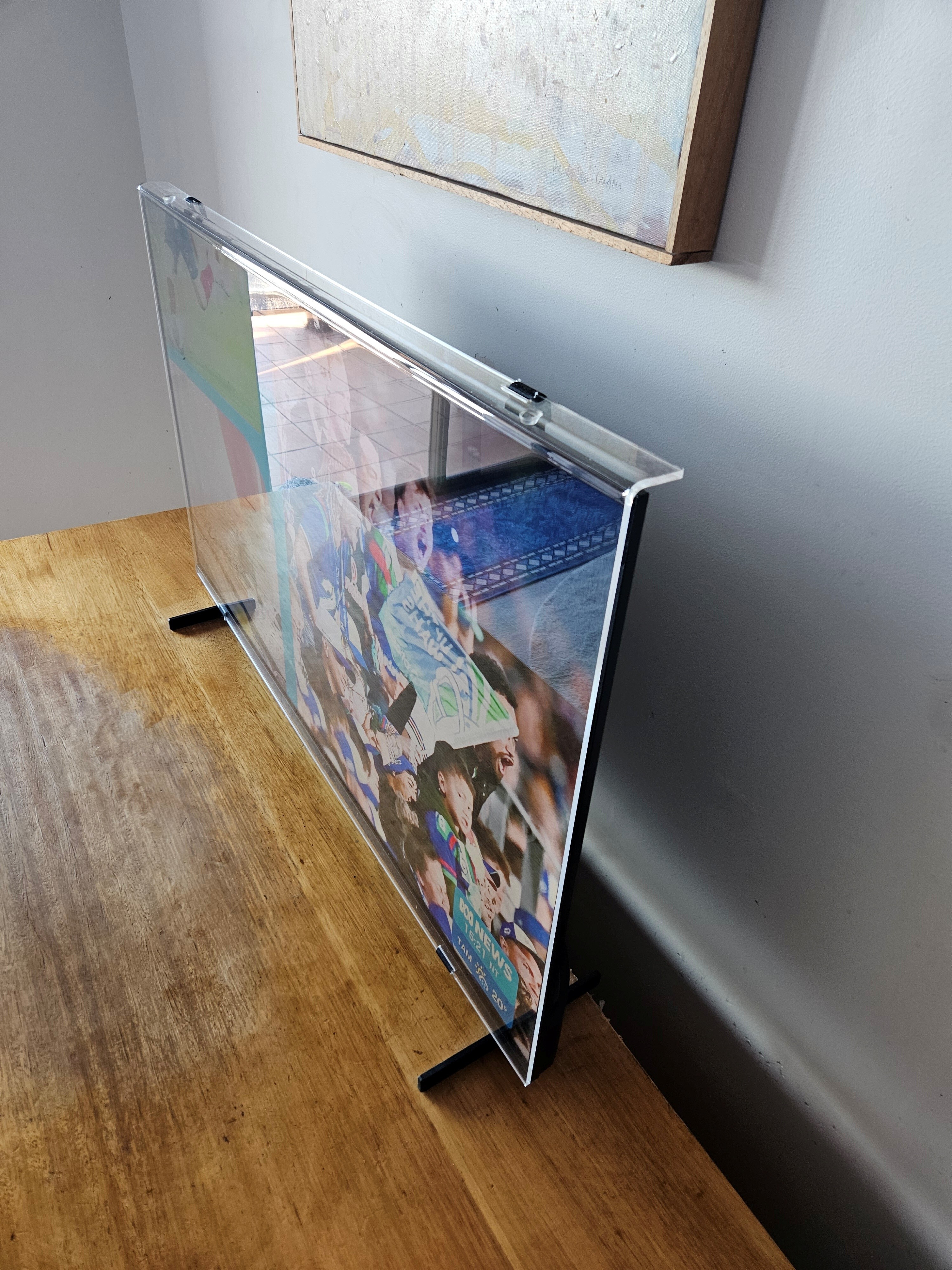 TV screen protector before installation, showing the clear acrylic panel