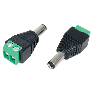 A view of two male DC plugs, one showing the front 2.1mm barrel and the other showing the screw terminal block.