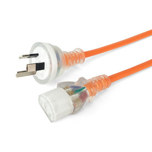 Side angled view of the extended 3-metre orange medical-grade power cord, showing the transparent IEC-C13 and Australian 3-pin ends.