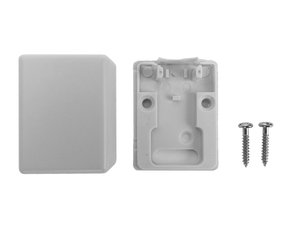 A top-down view of the open surface mount box with its cover alongside, showing the mounting screws.