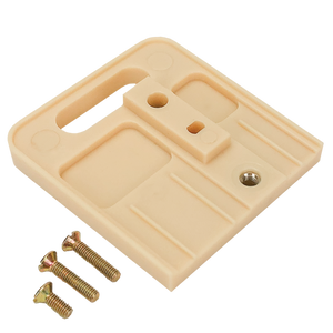 An underside view of the ivory stacking adaptor.