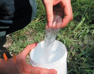 Removing Gemini Gel from the tub ready to fill an outdoor electrical junction box