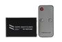 Top-down view of the 2-port HDMI switch and its accompanying IR remote control. Top-down view of the 2-port HDMI switch and its accompanying IR remote control.