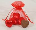 Red Sheer Bag with Three Red Chocolate Hearts