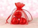Red Sheer Bag with Three Red Chocolate Hearts
