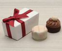 White table favour with a burgundy satin ribbon. Contains two Belgian style chocolates. 4361 - min order 25