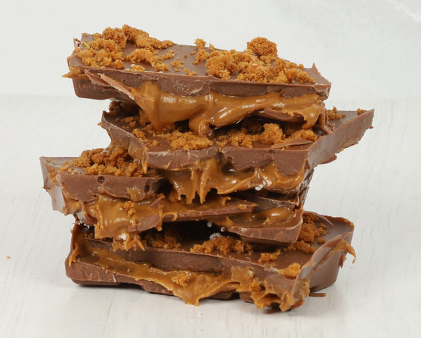 A limited edition Biscoff Bliss Slab. Indulge in the ultimate treat with this very special chocolate bar filled with smooth Biscoff and topped with Biscoff Crumb.