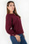 Blusa manga larga en seda con escote ojal