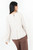 Blusa manga larga acampanada en gasa con escote ojal