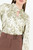 Blusa manga larga en satin estampado con cuello neru retorcido y escote V
