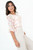 Blusa manga 3/4 en gasa estampada con escote redondo y mangas con ruffle