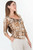Polo manga 3/4 en tull mesh digital con escote V y ruffle