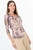 Polo manga 3/4 en tull mesh digital con escote V y ruffle