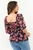 Blusa manga 3/4 en Alana D24 con escote cuadrado, bobitos y corte bajo busto