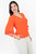 Blusa manga 3/4 en Brisa Bárbara con escote V, bobito en bocamanga y combinación de dos texturas.