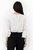 Blusa manga 3/4 en gasa labrada con escote ojal, abertura delantera y mangas con doble volante