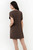 Vestido corto en tela Verona con manga corta, escote ojal y corte princesa lateral.