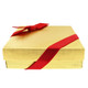 Gold foiled box with red elastic bow