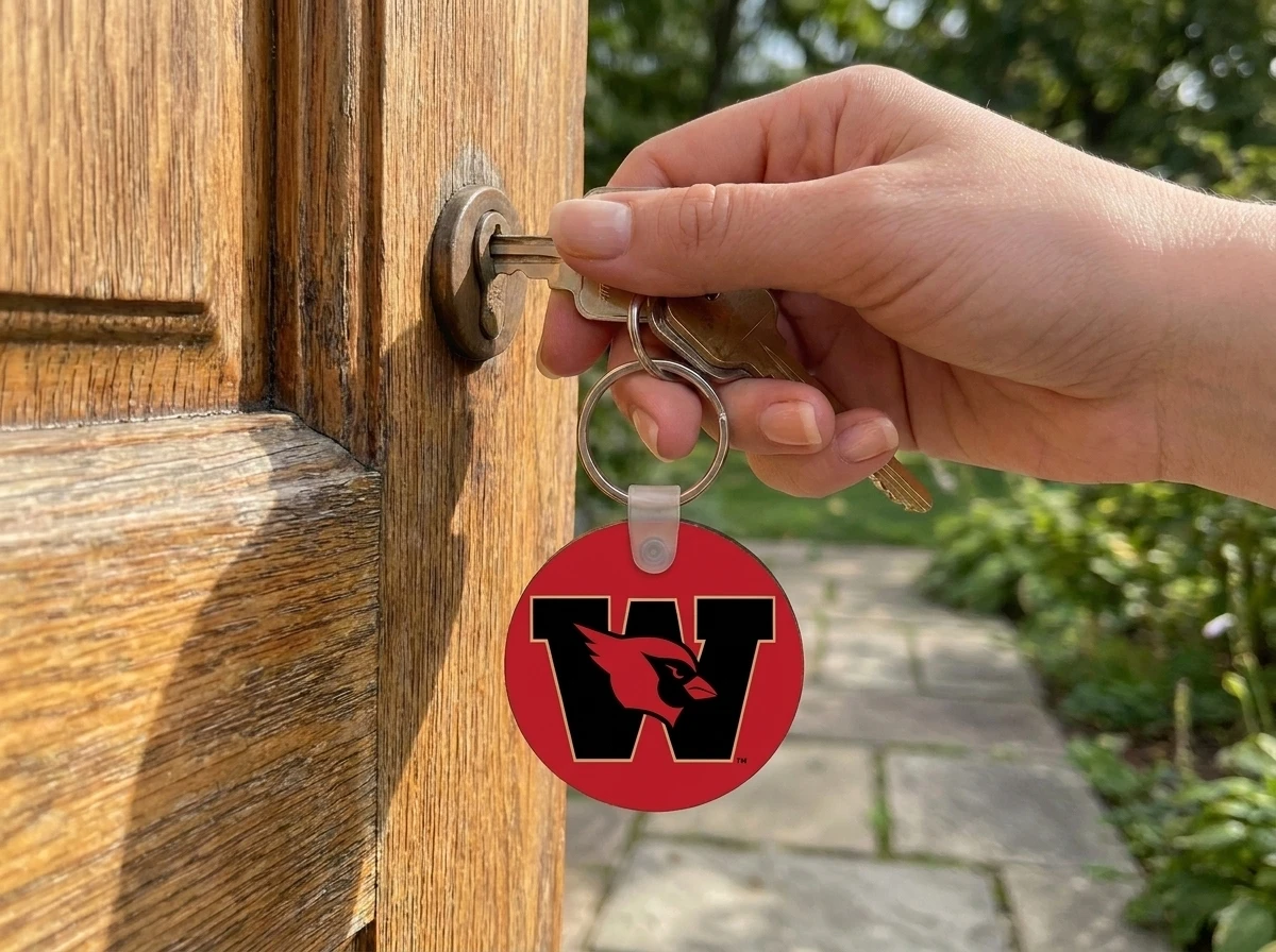 color printed wood keychain attached to key in door lock