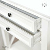 Image of the bedside table with the drawers open, showcasing the ample storage space.