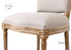 Zoomed-in view of the seat cushion, showcasing the comfort and durability of the linen upholstery.