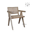 Angle view showcasing the chair’s overall design, including the elegant frame and textural rattan back