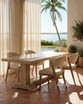 Styled angled view of the Charlested Oak Dining Table in a contemporary coastal home