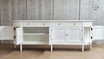 Full-length view of the Louis Curved Buffet with doors open, showcasing the interior space and shelves