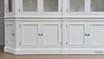 Close-up of the lower storage compartment of the Stonefield Double Display Cabinet Wall Unit with Angled Sides, emphasising the ample space and usability.