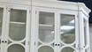 Detailed shot of the carved accents on the cabinet doors, adding a touch of sophistication.