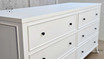Close-up of the top drawer knob detailing the elegant hardware.