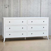 Angled  view of the Piastri Chest highlighting the sleek design and smooth surfaces.