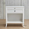 Front view of Piastri 1 Drawer Bedside Table showing the elegant white finish and sleek lines.