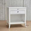 Angled view of Piastri 1 Drawer Bedside showcasing the spacious drawer, open shelf and an elegant silhouette.