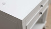 Close-up of the bedside table's surface, highlighting the paint stroke finish and quality craftsmanship