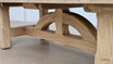 Close-up of the leg of the Trailbridge Canyon Coffee Table, showcasing the natural texture and quality of the greige wash oak.