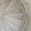 Close-up view of the table's surface, showing the precision of the parquetry