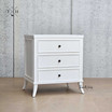 Angled view of Piastri Nightstand showcasing the three spacious drawers and elegant silhouette.
