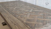 Top-down perspective of the Bedford Oak Dining Table, highlighting its silhouette and parquetry detailing